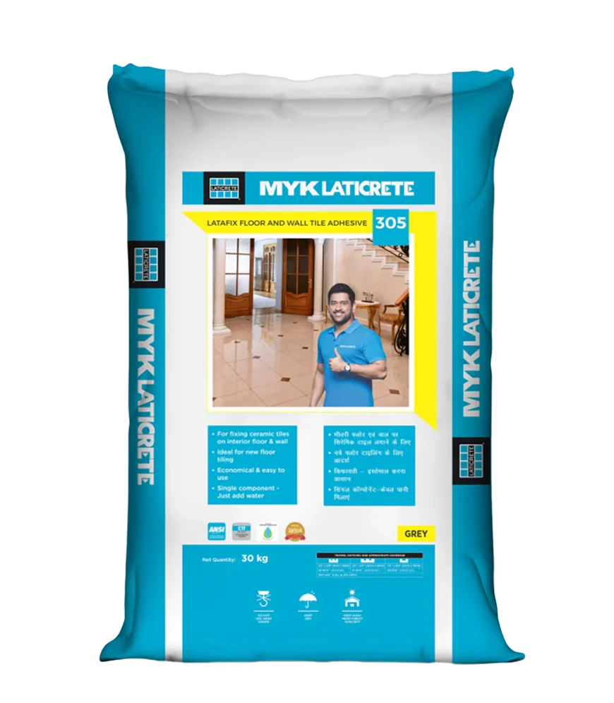 Professional tile installation using MYK Laticrete 305 adhesive with proper notched trowel technique for optimal coverage