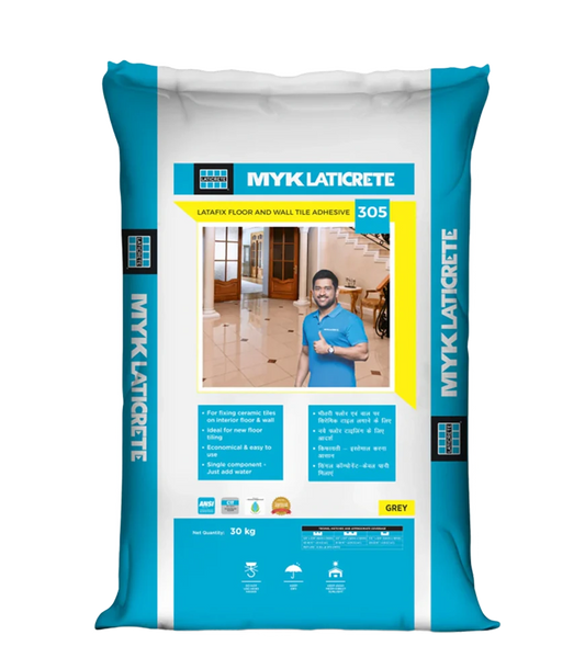 Professional tile installation using MYK Laticrete 305 adhesive with proper notched trowel technique for optimal coverage